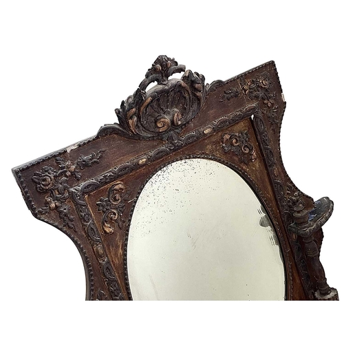 320 - A Victorian gilt gesso wall mirror. With an oval plate flanked by fluted columns and with neo-classi... 