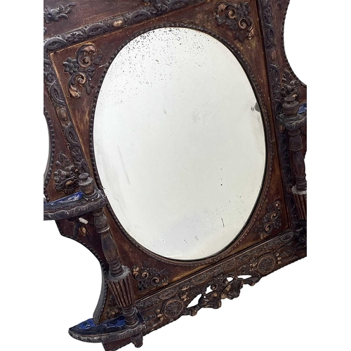 320 - A Victorian gilt gesso wall mirror. With an oval plate flanked by fluted columns and with neo-classi... 