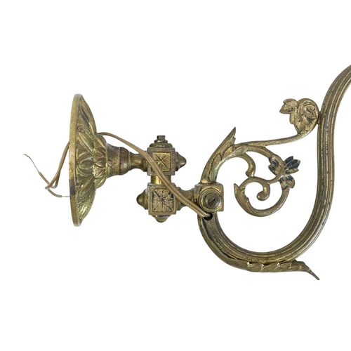 338 - A pair of cast brass wall lights. With crystal drops, height 21cm, depth 30cm (2).