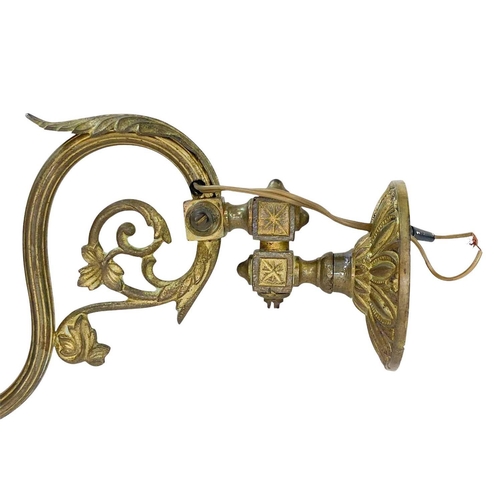 338 - A pair of cast brass wall lights. With crystal drops, height 21cm, depth 30cm (2).