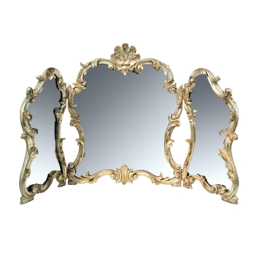 340 - A rococo style silvered triptych dressing table mirror. Early 20th century, the frame carved with a ... 