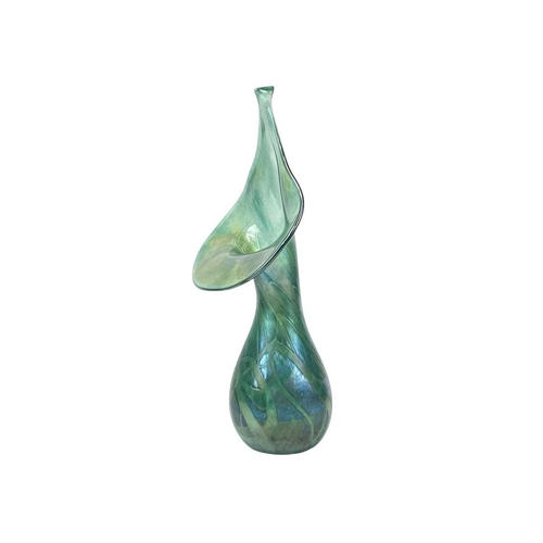 344 - Studio pottery and glass. Comprising an iridescent green glass jack in the pulpit vase, height 32cm,... 