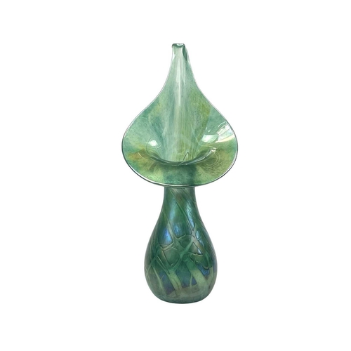 344 - Studio pottery and glass. Comprising an iridescent green glass jack in the pulpit vase, height 32cm,... 