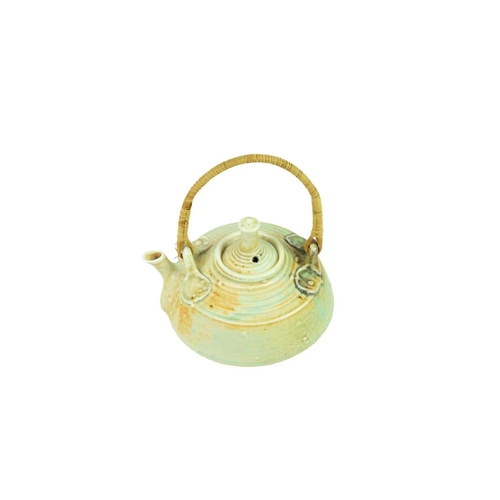 373 - Mary Rich (1940) miniature porcelain teapot and cover. Wicker handle, impressed mark to base, height... 