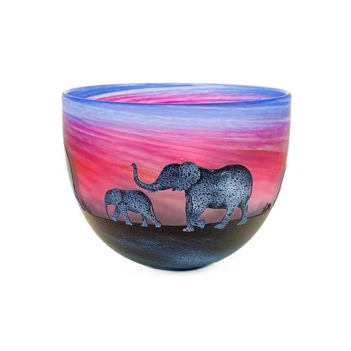 386 - Malcolm Sutcliffe (1954). A studio glass bowl, deeply etched with silhouettes of an elephant family ... 