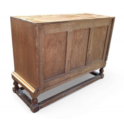 418 - A Heals light oak sideboard. Fitted two doors flanking a deep cellarette drawer, with three further ... 