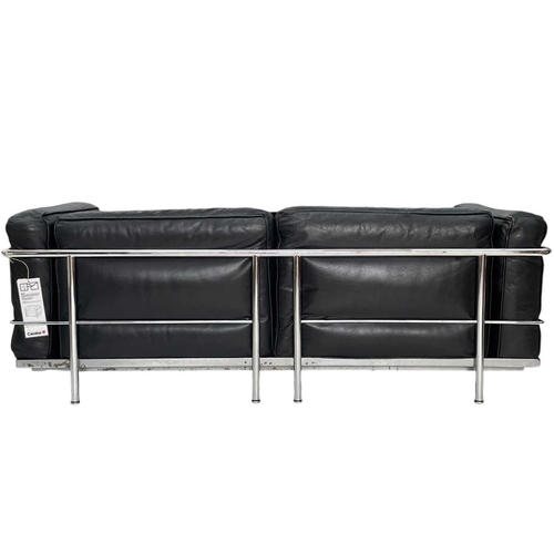 421 - A Le Corbusier design leather and chrome two-seater sofa. With an attached Cassina label, with black... 