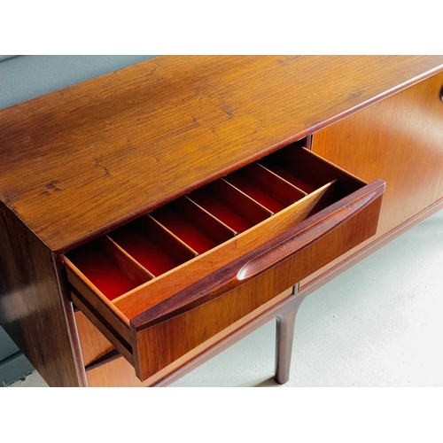 422 - A mid-century McIntosh teak sideboard. Fitted two central cupboard doors flanked by three drawers, a... 