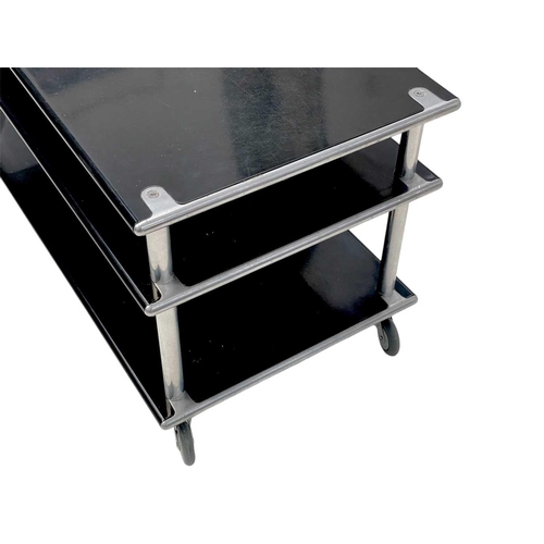 425 - A Habitat lacquered steel three tier side unit on castor wheels. Height 52cm, width 100cm, depth 50c... 