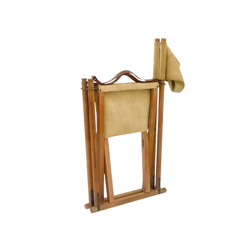 426 - A Danish teak and canvas Mogens Koch folding directors chair Brass label, height 89cm.