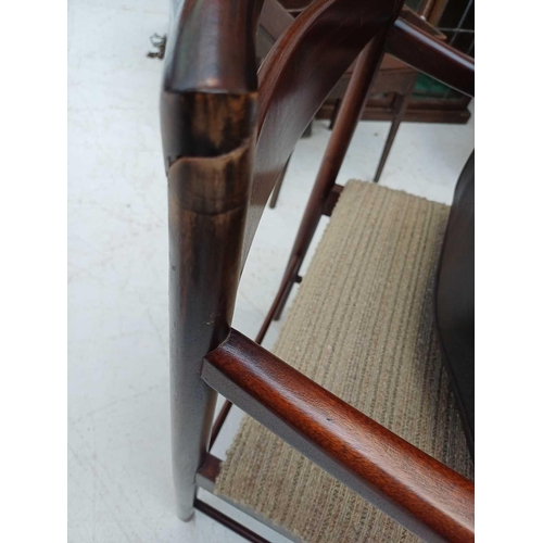 430 - A mid-century McIntosh teak extending dining table and ten chairs. The table with two additional fol... 