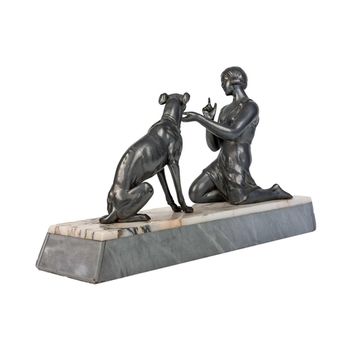 438 - An Art Deco spelter figure of a kneeling lady and greyhound. On a marble base, with an attahed plaqu... 