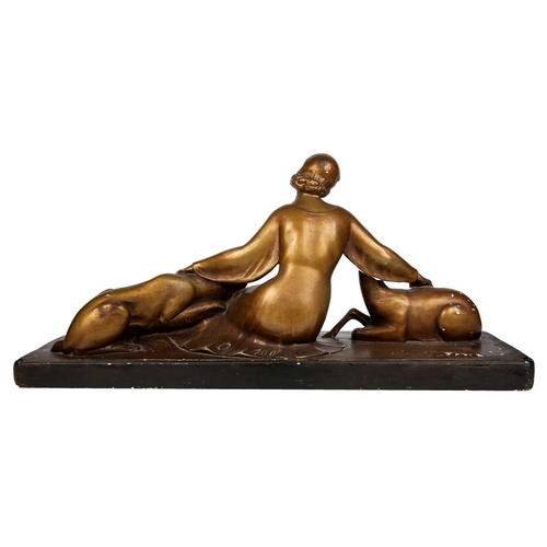 438 - An Art Deco spelter figure of a kneeling lady and greyhound. On a marble base, with an attahed plaqu... 