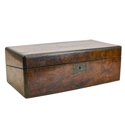 49 - A Victorian walnut brass bound writing box. The hinged lid lifts to reveal a fitted interior, height... 