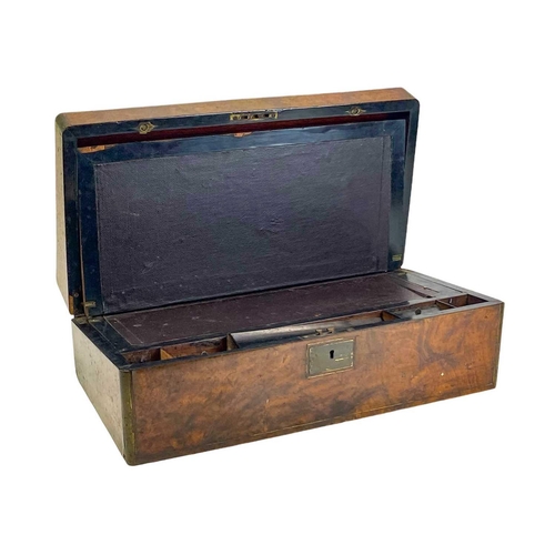 49 - A Victorian walnut brass bound writing box. The hinged lid lifts to reveal a fitted interior, height... 