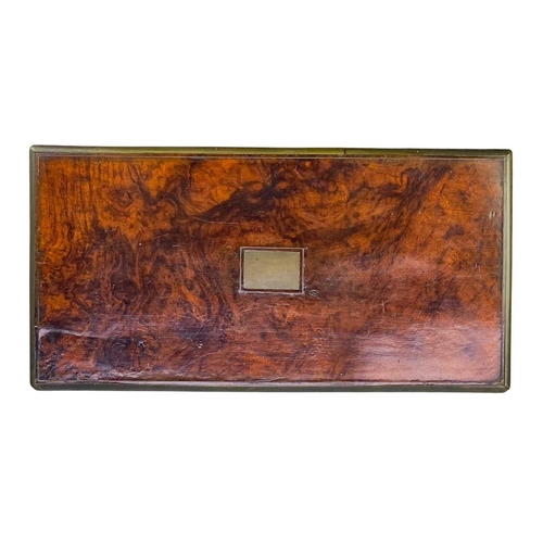 49 - A Victorian walnut brass bound writing box. The hinged lid lifts to reveal a fitted interior, height... 