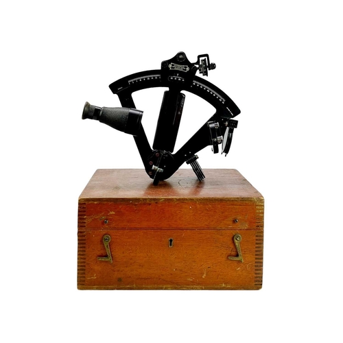 500 - A black lacquered and bakelite Hezzanith sextant. The mahogany finish stow case with a certificate d... 