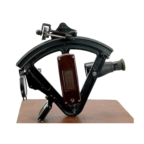 500 - A black lacquered and bakelite Hezzanith sextant. The mahogany finish stow case with a certificate d... 