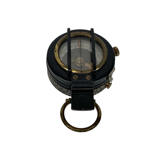 506 - A WWII era lacquered brass MK IX prismatic marching compass. Broad arrow mark and 1943 date to the b... 