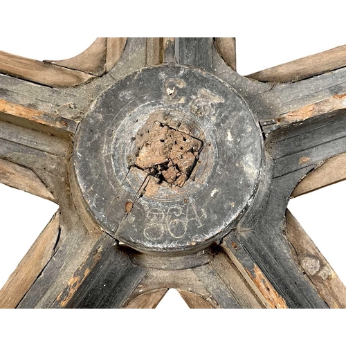 51 - A large painted wood and pine cog pattern. Stamped number 364, diameter 83cm.