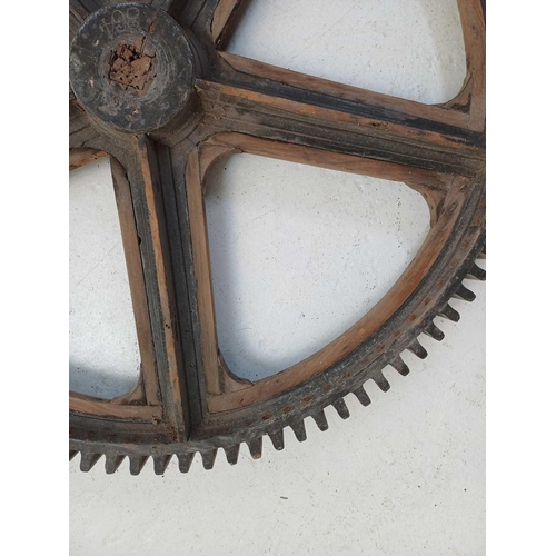 51 - A large painted wood and pine cog pattern. Stamped number 364, diameter 83cm.