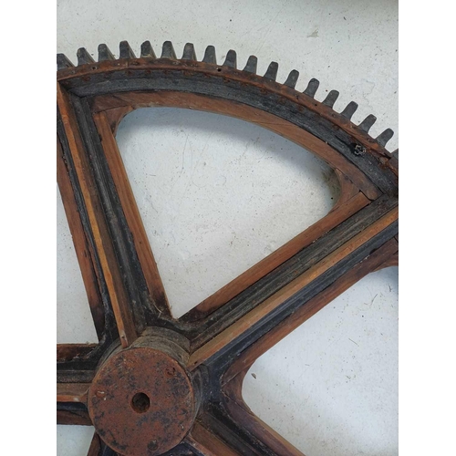 51 - A large painted wood and pine cog pattern. Stamped number 364, diameter 83cm.