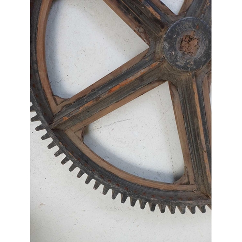 51 - A large painted wood and pine cog pattern. Stamped number 364, diameter 83cm.