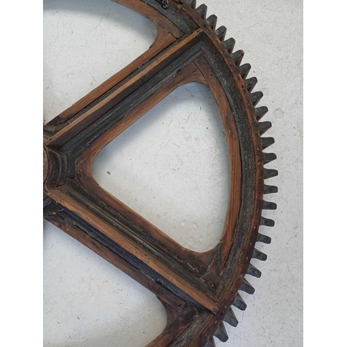 51 - A large painted wood and pine cog pattern. Stamped number 364, diameter 83cm.