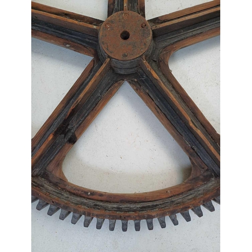 51 - A large painted wood and pine cog pattern. Stamped number 364, diameter 83cm.