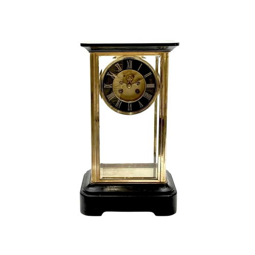 527A - A French four-glass mantel clock. Late 19th century, with black marble top and base and the dial wit... 