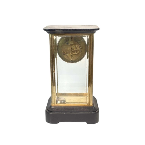 527A - A French four-glass mantel clock. Late 19th century, with black marble top and base and the dial wit... 