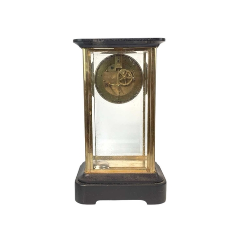 527A - A French four-glass mantel clock. Late 19th century, with black marble top and base and the dial wit... 