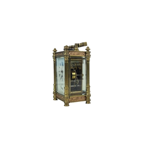 528 - A French carriage alarm clock. Late 19th century, with embossed copper panels, and brass column supp... 