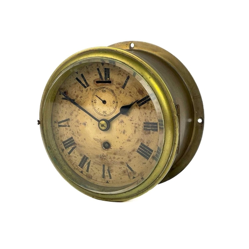 531 - A Smiths brass ship's bulkhead clock. Diameter 18cm, together with a Short & Mason compensated anero... 