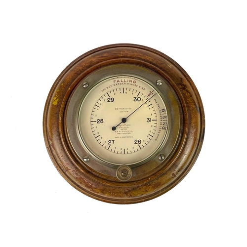 531 - A Smiths brass ship's bulkhead clock. Diameter 18cm, together with a Short & Mason compensated anero... 