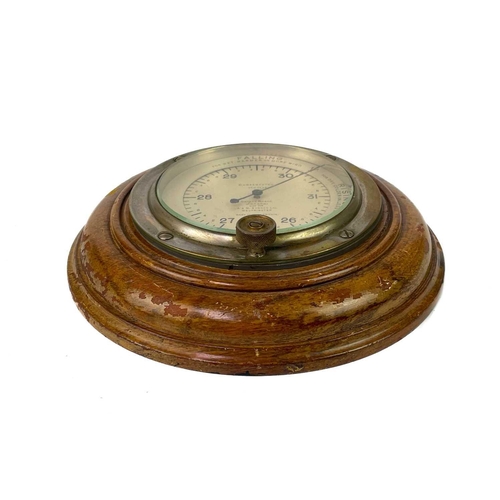 531 - A Smiths brass ship's bulkhead clock. Diameter 18cm, together with a Short & Mason compensated anero... 