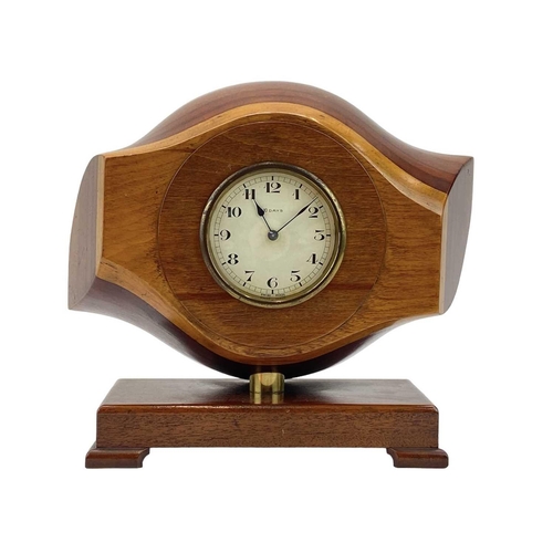 532 - A laminated wooden propeller mantle clock. The central hub with inset Swiss made movement, height 26... 