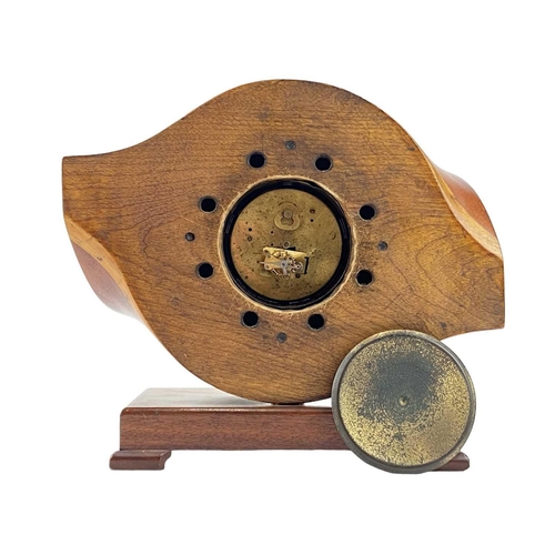 532 - A laminated wooden propeller mantle clock. The central hub with inset Swiss made movement, height 26... 