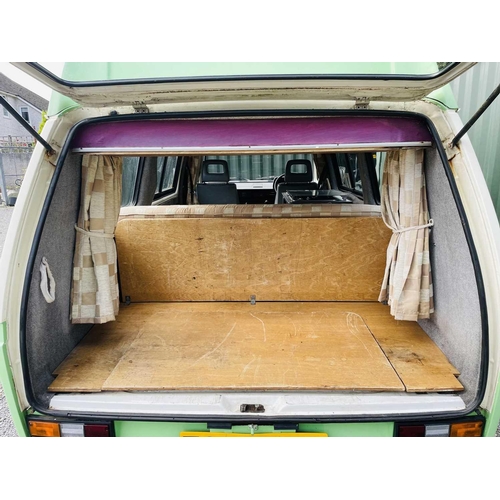 537 - A VW T25 Campervan, 1987. Water-cooled engine, MOT until June 2025, petrol, sleeps four with built-i... 