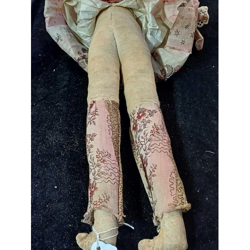 550 - A German papier mache shoulder head doll. Circa 1850, with painted hair and face details, stuffed co... 