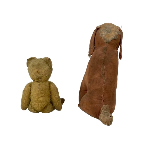 551 - An English plush teddy bear. 1950s, with cantilever button operated opening mouth, length 40cm, play... 