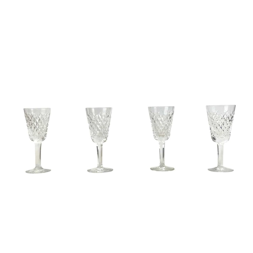 553 - A Waterford Crystal Alana pattern part suite. Comprising: six tumblers, six hock, three claret and f... 