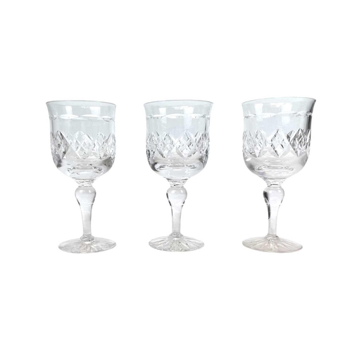 556 - A Tudor Crystal part suite. Comprising: six champagne flutes, six wine, five sherry glasses and two ... 