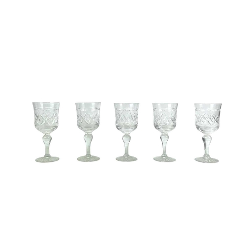 556 - A Tudor Crystal part suite. Comprising: six champagne flutes, six wine, five sherry glasses and two ... 