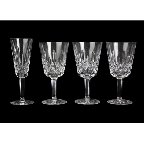 560 - Waterford Crystal Part Suite. Lismore pattern, comprising: four Hock glasses, four claret glasses, t... 