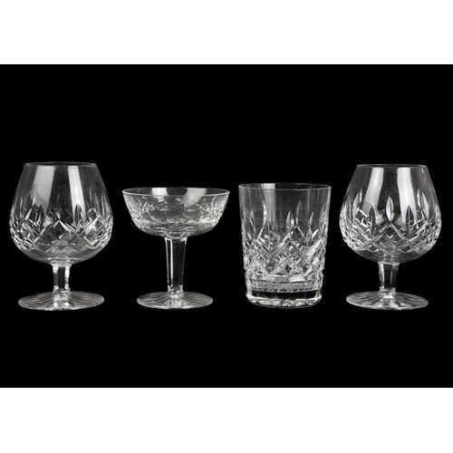 560 - Waterford Crystal Part Suite. Lismore pattern, comprising: four Hock glasses, four claret glasses, t... 