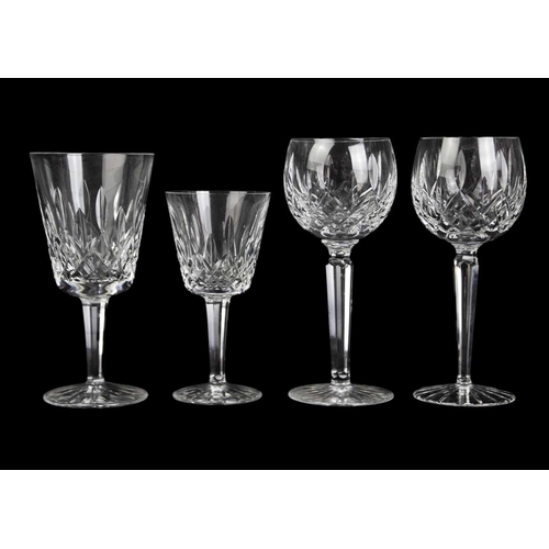 560 - Waterford Crystal Part Suite. Lismore pattern, comprising: four Hock glasses, four claret glasses, t... 