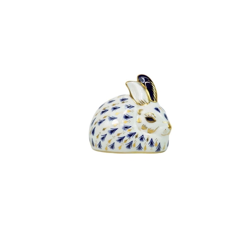 564 - Two Royal Crown Derby rabbit paperweights. With gilt stoppers, together with a Herend group of two d... 