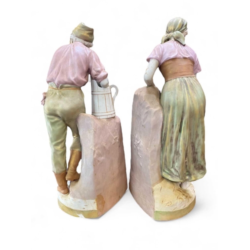 568 - A large pair of Royal Dux porcelain figures of water carriers. Height 60cm. (2)