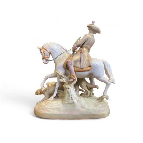 570 - A large Royal Dux porcelain figure group of a hunter on horseback with hounds. Height 49cm. No condi... 